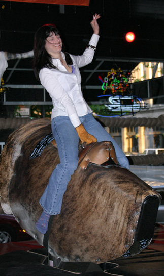 Riding the mechanical bull at Cowgirls Inc