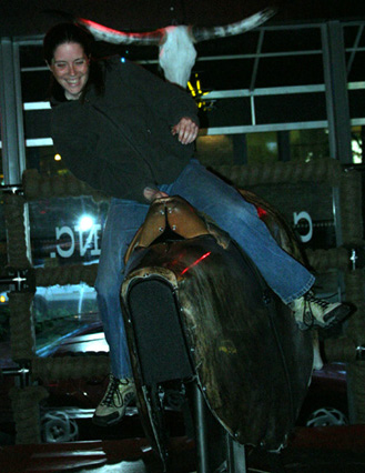 Riding the mechanical bull at Cowgirls Inc